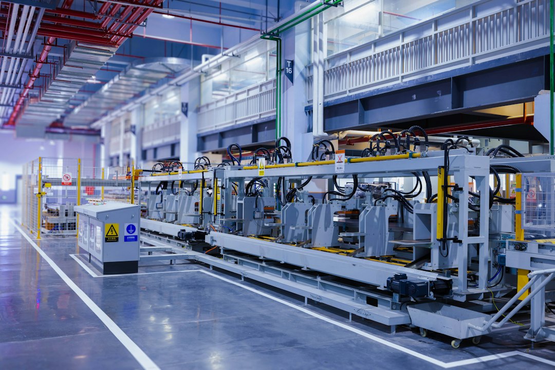 An automated factory floor with rows of manufacturing equipment