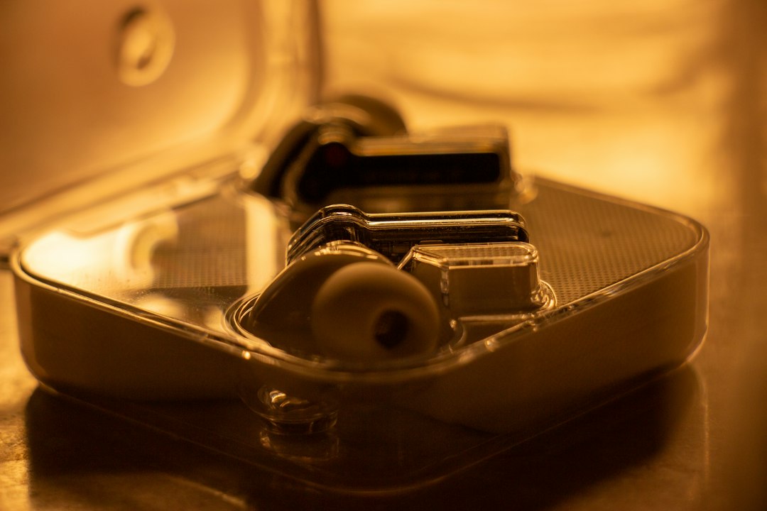 In-ear earbuds with silicone tips resting in their case