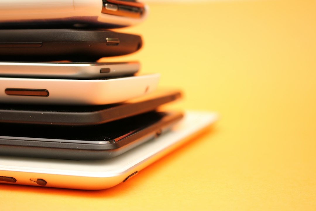 A stack of older tablets piled together