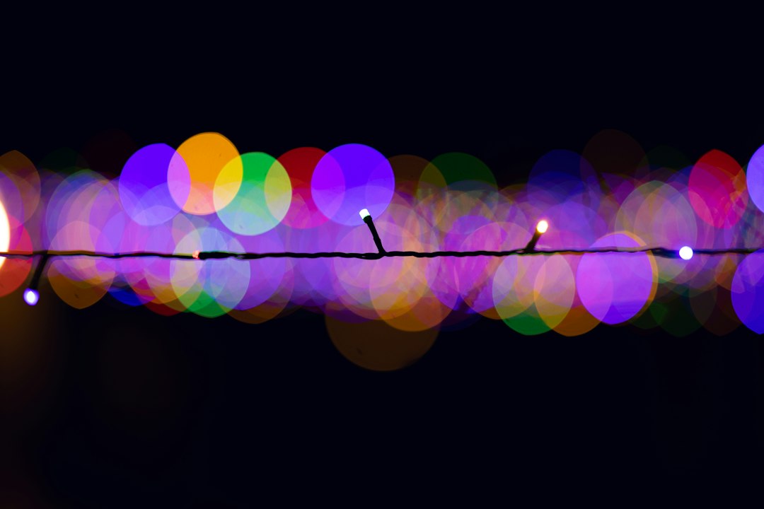 Closeup of glowing multicolored LED string lights