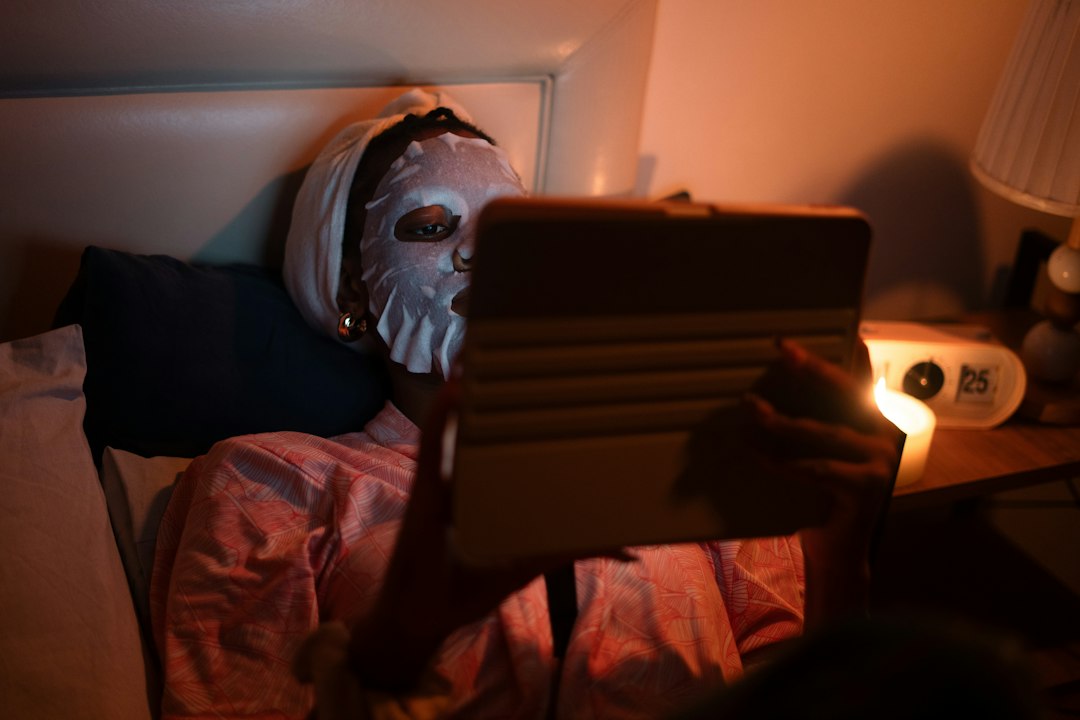 Person reading in bed by warm lamplight, the Paperwhite home turf
